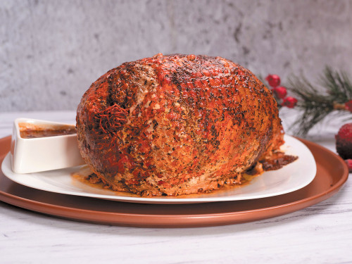 Pierna de cerdo en malla con gravy de cebolla dulce